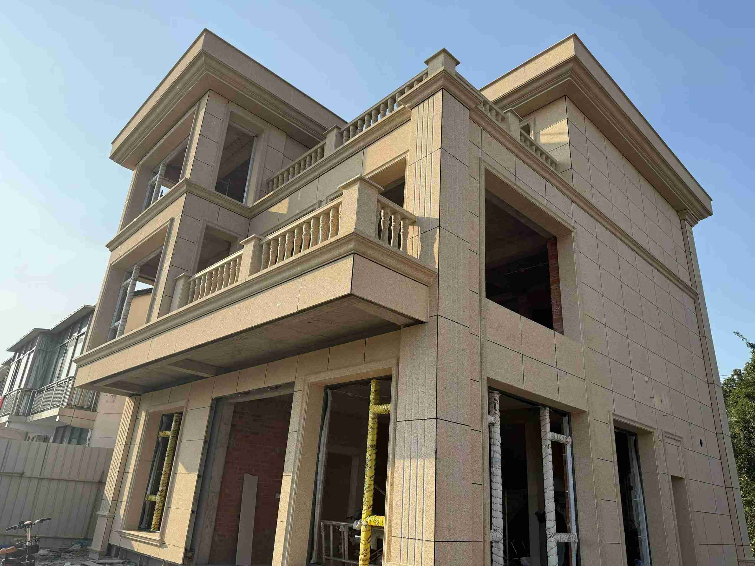 白城 黄金麻花岗岩石材荔枝面外墙干挂效果展示